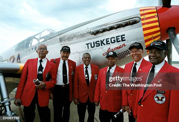 Members of the famed Tuskegee Airmen, James Pryde, William Broadwater, Sam O'Dennis, Freddie Robinson, J. Byron Morris and Charles Thompson stand...