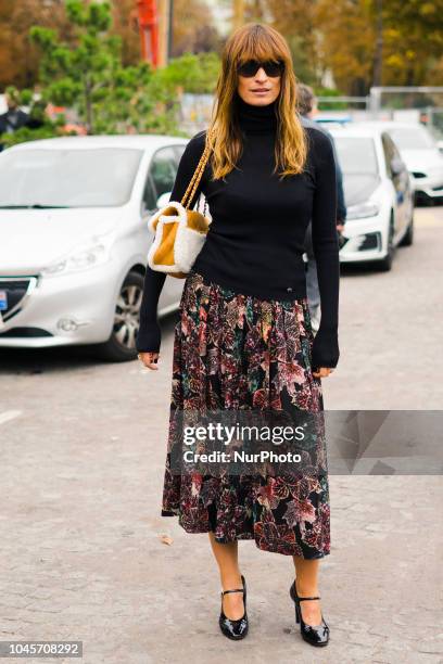 Guest is seen on the street during Paris Fashion Week SS19 wearing Chanel on October 2, 2018 in Paris, France.