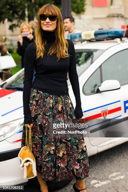 Guest is seen on the street during Paris Fashion Week SS19 wearing Chanel on October 2, 2018 in Paris, France.