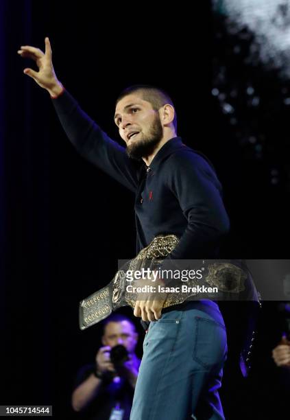 Lightweight champion Khabib Nurmagomedov waves during a press conference for UFC 229 at Park Theater at Park MGM on October 04, 2018 in Las Vegas,...