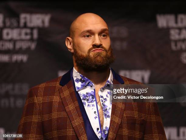 Professional boxer Tyson Fury looks on onstage during a press conference to promote his upcoming December 1, 2018 fight against Deontay Wilder in Los...