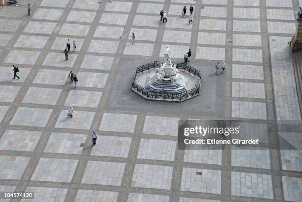 people walking through gendarmenmarkt, berlin, germany - gendarmenmarkt stock pictures, royalty-free photos & images
