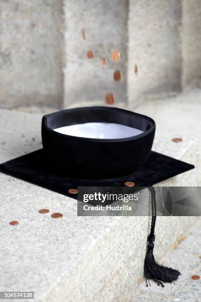 copper coins falling into mortarboard - us coin falling stock pictures, royalty-free photos & images