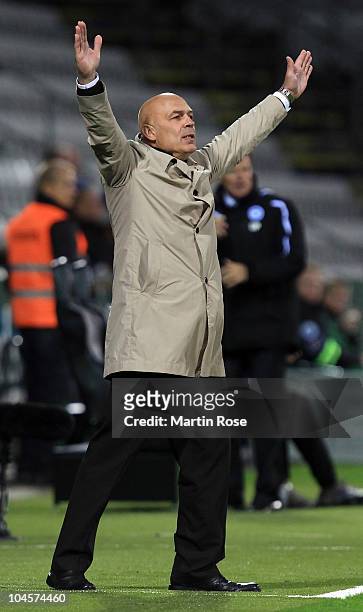 Christian Gross, head coach of Stuttgart celebrates his team's opening goal during the UEFA Europa League group H match between Odense Boldklub and...