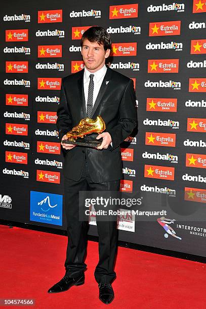 Lionel Messi receives the Golden Boot award wearing Dolce & Gabbana clothing at the Old Estrella Damn Factory on September 30, 2010 in Barcelona,...