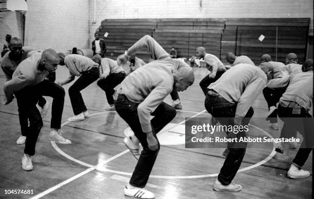 Fraternity pledges for Omega Psi Phi practice their stepping routine in the Fisk University gymnasium, Nashville, Tennessee, 1969.