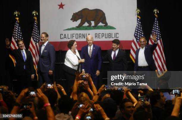 Former U.S. Vice President Joe Biden stands with congressional candidates Mike Levin , L, Harley Rouda , 2nd L, Katie Porter , 3rd L, TJ Cox , 2nd R,...