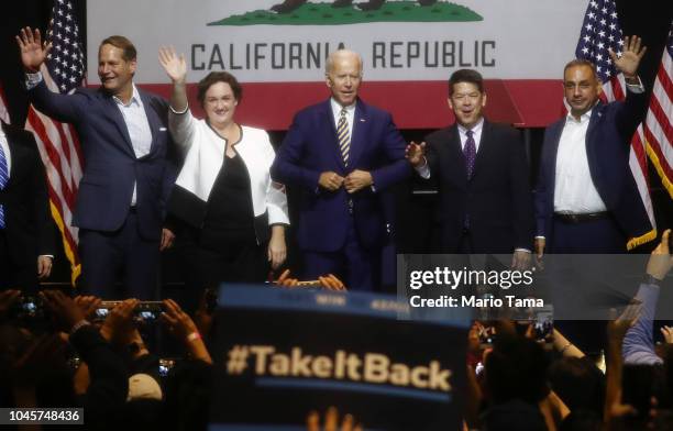 Former U.S. Vice President Joe Biden stands with congressional candidates Harley Rouda , L, Katie Porter , 2nd L, TJ Cox , 2nd R, and Gil Cisneros ,...