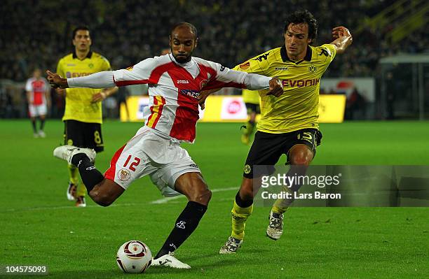 Frederic Kanoute of Sevilla is challenged by Mats Hummels of Dortmund during the UEFA Europa League group J match between Borussia Dortmund and...