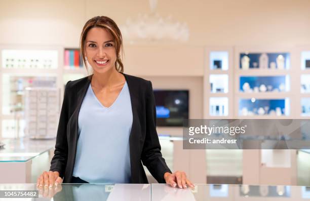 happy saleswoman working at a jewelry store - jeweller stock pictures, royalty-free photos & images