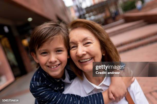 portrait of a happy grandmother with her grandson - basslet stock pictures, royalty-free photos & images