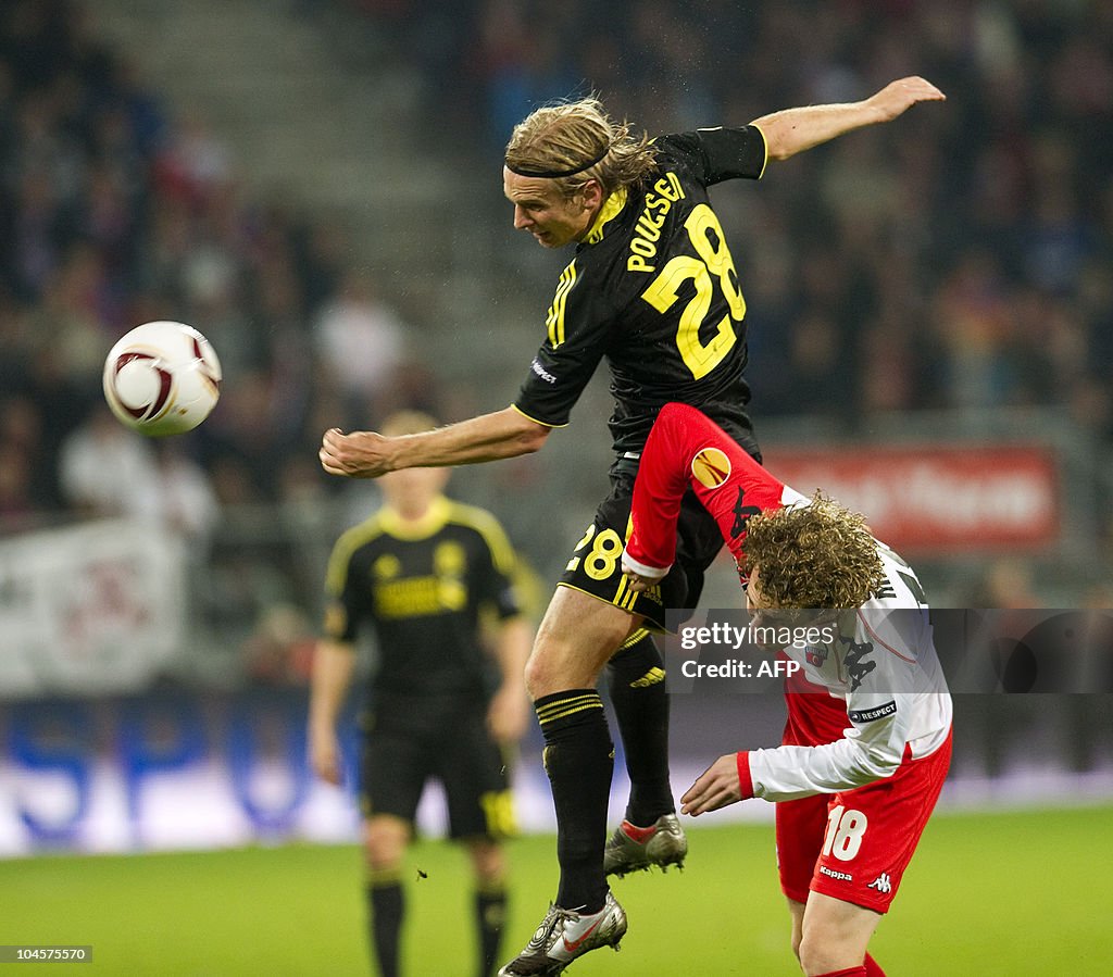 Liverpool player Christian Poulsen (L) v