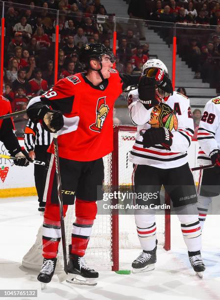 Alex Formenton of the Ottawa Senators clashes with Duncan Keith of the Chicago Blackhawks at Canadian Tire Centre on October 4, 2018 in Ottawa,...