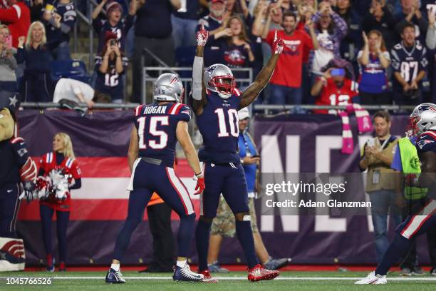 Josh Gordon of the New England Patriots celebrates with Chris Hogan after catching a touchdown pass from Tom Brady during the fourth quarter against...