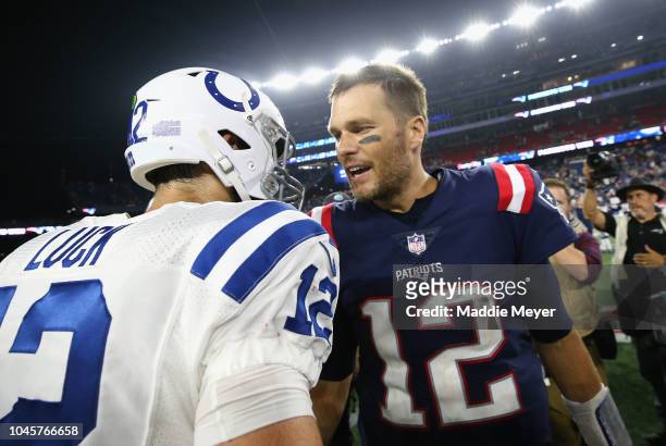 Tom Brady of the New England Patriots shakes hands with Andrew Luck of the Indianapolis Colts after the Patriots defeated the Colts 38-24 at Gillette...