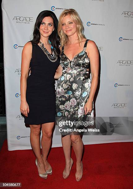 Owner of ARCADE Boutique Rochelle Gores Fredston and actress Amy Smart arrive at ARCADE Boutique's 'The Autumn Party' benefiting Children's...