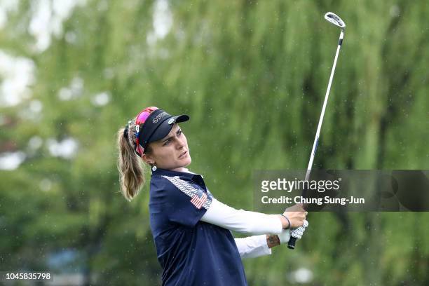 Lexi Thompson of the United States hits a tee shot on the 5th hole in the Pool B match between Japan and USA on day two of the UL International Crown...