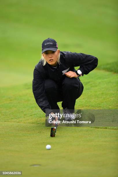 Michelle Wie of the United States lines up for a putt on the 6th hole in the Pool B match between Japan and USA on day two of the UL International...