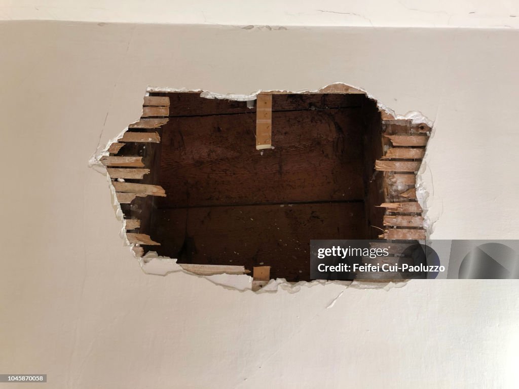 A big hole on the wall in an  abandoned building at Vevey, Switzerland