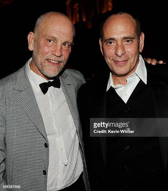 Actors John Malkovich and Nestor Serrano pose at the after party for the premiere of Walt Disney Pictures' "Secretariat" at the Roosevelt Hotel on...