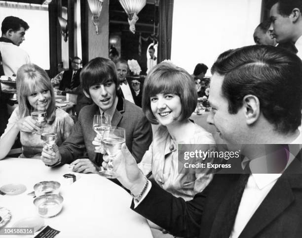 Pop star George Harrison of The Beatles, Beatle manager Brian Epstein, singer Cilla Black and her friend Patti Boyd, on May 28, 1964.