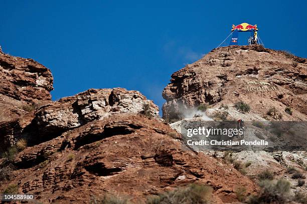 Kelly McGarry of New Zealand practices during the Red Bull Rampage biking competition on September 29, 2010 in Virgin, Utah. The Red Bull Rampage is...