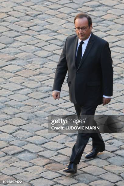 Former French President Francois Hollande arrives to attend the national homage to French-Armenian singer-songwriter Charles Aznavour at the...