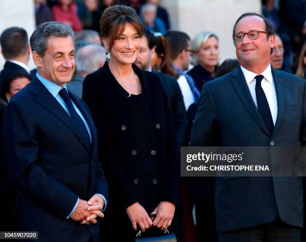 Former French President Nicolas Sarkozy and his wife Carla Bruni and French President Francois Hollande attend the national homage to French-Armenian...