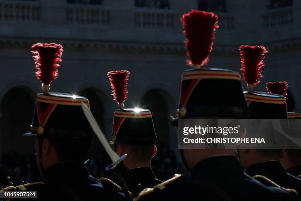Soldiers stand guard during the national homage to French-Armenian singer-songwriter Charles Aznavour at the Invalides in Paris on October 5, 2018. -...