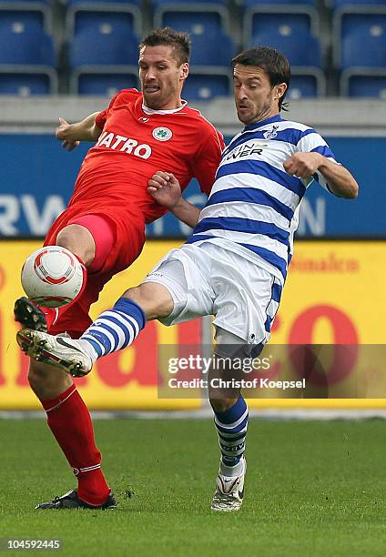 Branimir Bajicl of Duisburg challenges Ronny Koenig of Oberhausen during the Second Bundesliga match between MSV Duisburg and RW Oberhausen at...