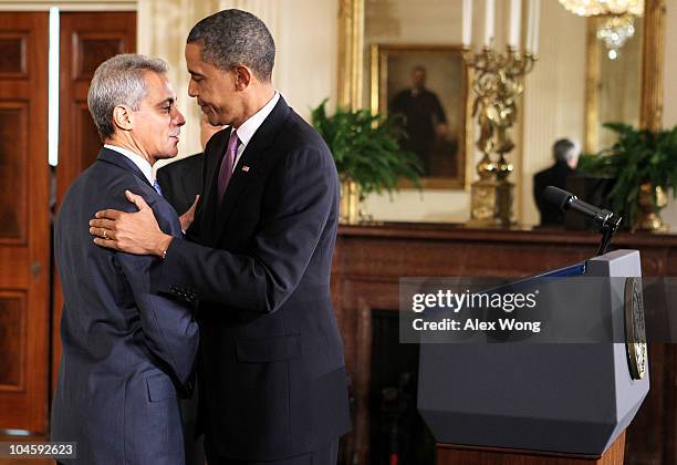 President Barack Obama embraces chief of staff Rahm Emanuel during Emanuel's resignation announcement in the East Room October 1, 2010 at the White...