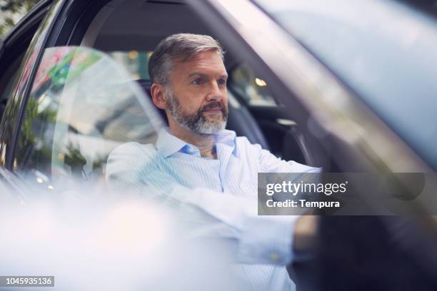 business on the move, riding a car. - driving australia stock pictures, royalty-free photos & images