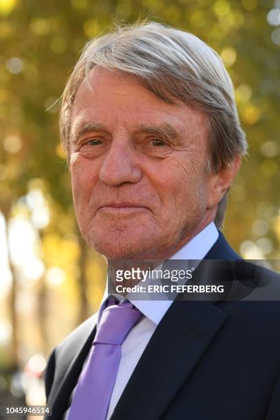 Former minister Bernard Kouchner poses after attending the national homage to French-Armenian singer-songwriter Charles Aznavour at the Invalides in...