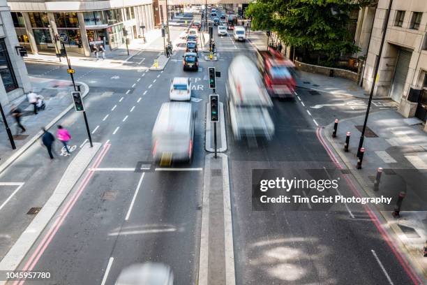 high angle view of traffic on a busy city street - uk now stock pictures, royalty-free photos & images