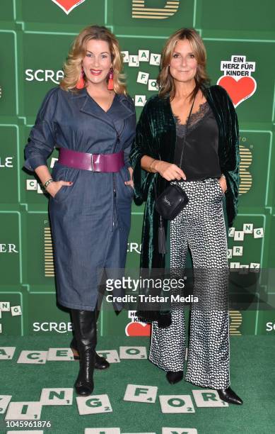 Alexa Maria Surholt and Kim Fisher attend the charity event PLACE TO B Playing for Charity at Restaurant GRACE on October 4, 2018 in Berlin, Germany.