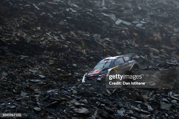 Sebastien Ogier of France and M-Sport Ford World Rally Team drives with co-driver Julien Ingrassia of France during the Slate Mountain stage on day...