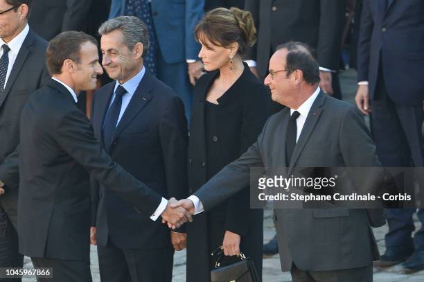 France President Emmanuel Macron shake hands of Francois Hollande next to Nicolas Sarkozy and Carla Brunyduring the national Tribute at Les Invalides...