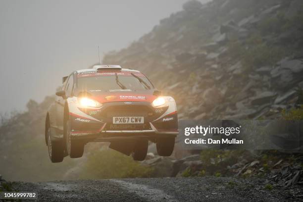 Gus Greensmith of Great Britain and Gus Greensmith drives with co-driver Alex Gelsomino of the United States during the Slate Mountain Stage on day...