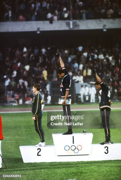 Summer Olympics: Australia Peter Norman , USA Tommie Smith , and USA John Carlos on medal stand during Men's 200M medal presentation at Estadio...