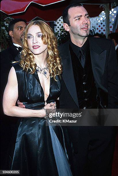Madonna and Christopher Ciccone during The 70th Annual Academy Awards - Red Carpet at Shrine Auditorium in Los Angeles, California, United States.