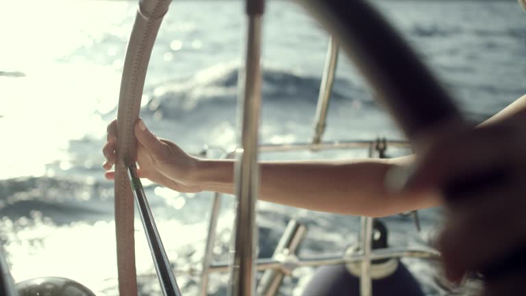 https://media.gettyimages.com/id/1046030844/video/woman-steers-the-yacht.jpg?b=1&s=640x640&k=20&c=xbXE6bMaaQqTdDG3V9O5o-hMOjWu4RL1kcEK3K9DMUg=