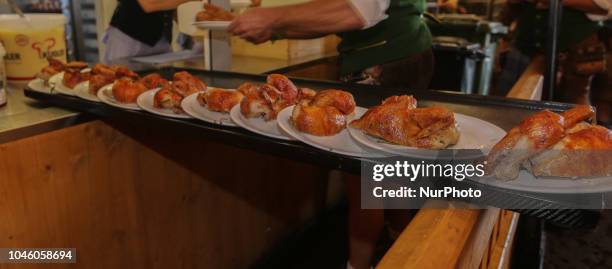 Dozen of half chicken on a tableau on Day 12 of the Oktoberfest. The Oktoberfest is the largest Volksfest in the world. It will take place until...