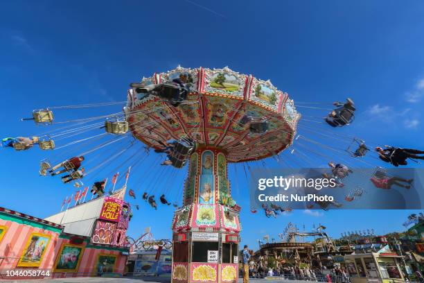 People enjoying the swing carousel on Day 12 of the Oktoberfest. The Oktoberfest is the largest Volksfest in the world. It will take place until...