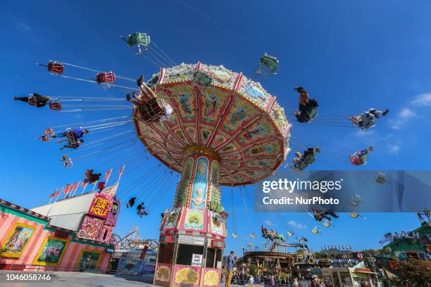 People enjoying the swing carousel on Day 12 of the Oktoberfest. The Oktoberfest is the largest Volksfest in the world. It will take place until...