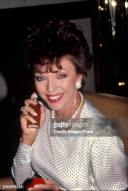 Joan Collins Promotes Revlon's 'Scoundrel' Perfume circa 1983 in New York City.