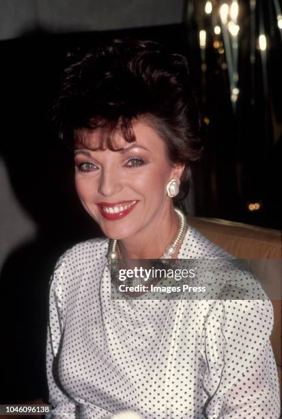 Joan Collins Promotes Revlon's 'Scoundrel' Perfume circa 1983 in New York City.