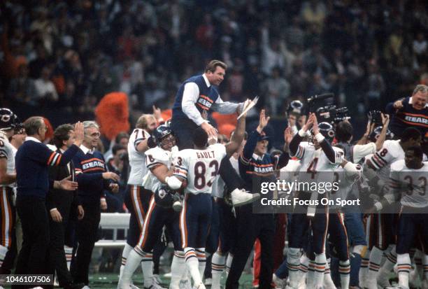 Head Coach Mike Ditka of the Chicago Bears gets carried off the field by his players after they defeated the New England Patriots in Super Bowl XX...