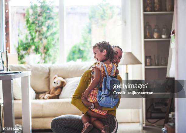loving mom sends adorable daughter off to school - kids backpack stock pictures, royalty-free photos & images