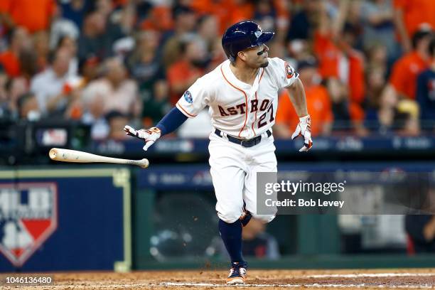 Jose Altuve of the Houston Astros watches his solo home run in the fifth inning off Corey Kluber of the Cleveland Indians during Game One of the...