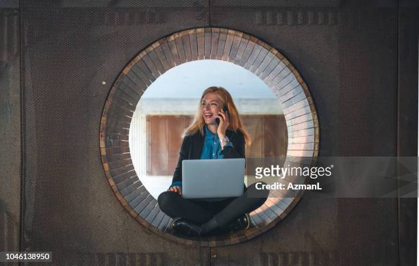 woman working outdoors - circle stock pictures, royalty-free photos & images